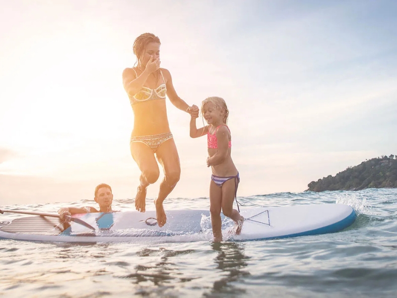 family paddleboarding on noosa river