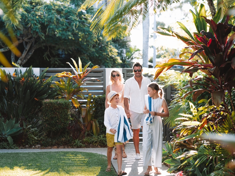 family walking into noosa place resort